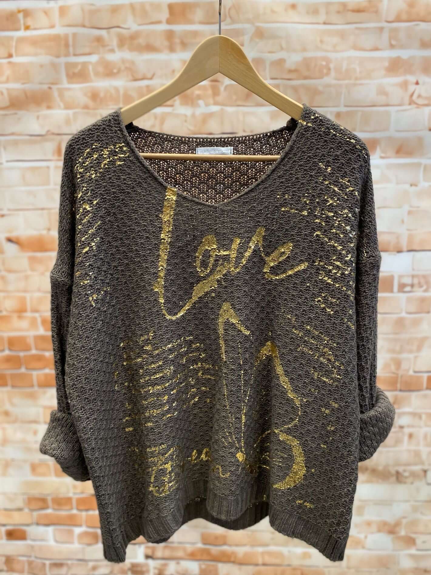 Strickpullover mit goldener Aufschrift