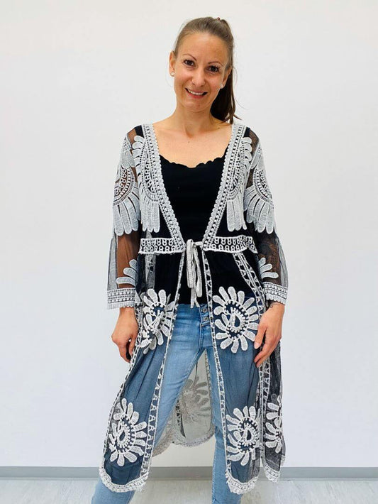 Schwarze Netztunika mit Blumen